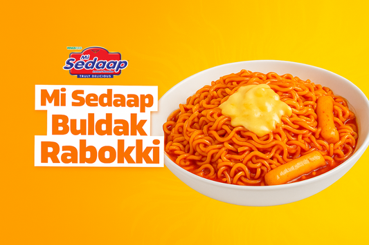 Mi Sedaap Buldak Rabokki noodles served with spicy sauce, cheese topping, and rice cakes in a white bowl.