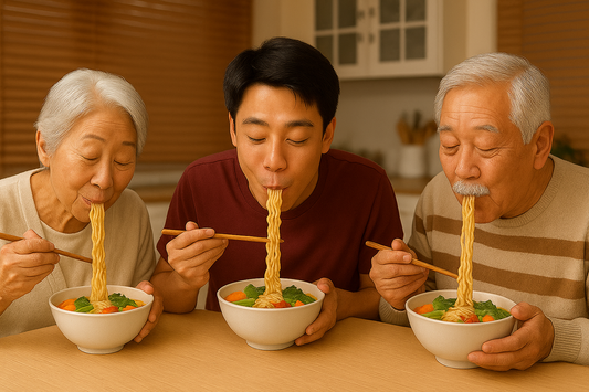 Three people from different generations enjoying bowls of ramen with chopsticks at the table.