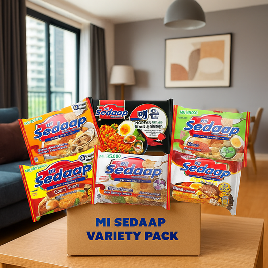 Mi Sedaap instant noodle variety pack with five different flavors displayed on a box in a modern living room.