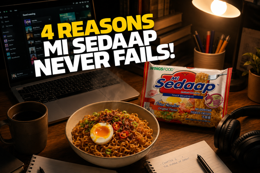 A late-night study or work setup featuring a bowl of prepared fried noodles with a soft-boiled egg, a pack of Mi Sedaap Goreng, a laptop, and a mug under a desk lamp. Bold overlay text reads "4 REASONS MI SEDAAP NEVER FAILS!"