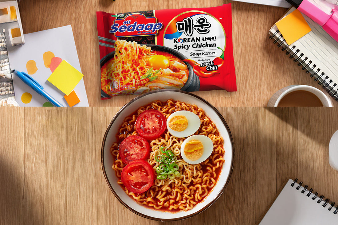 Mi Sedaap Korean Spicy Chicken ramen served with boiled eggs, tomato slices, and green onions.