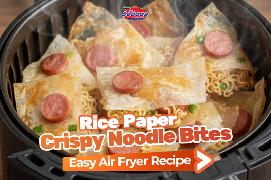 Air fryer rice paper noodle bites topped with sliced sausage.