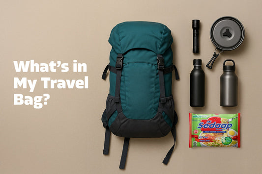 A flat lay graphic featuring a green backpack, camping gear, and a pack of Mi Sedaap noodles with the text "What's in My Travel Bag?"